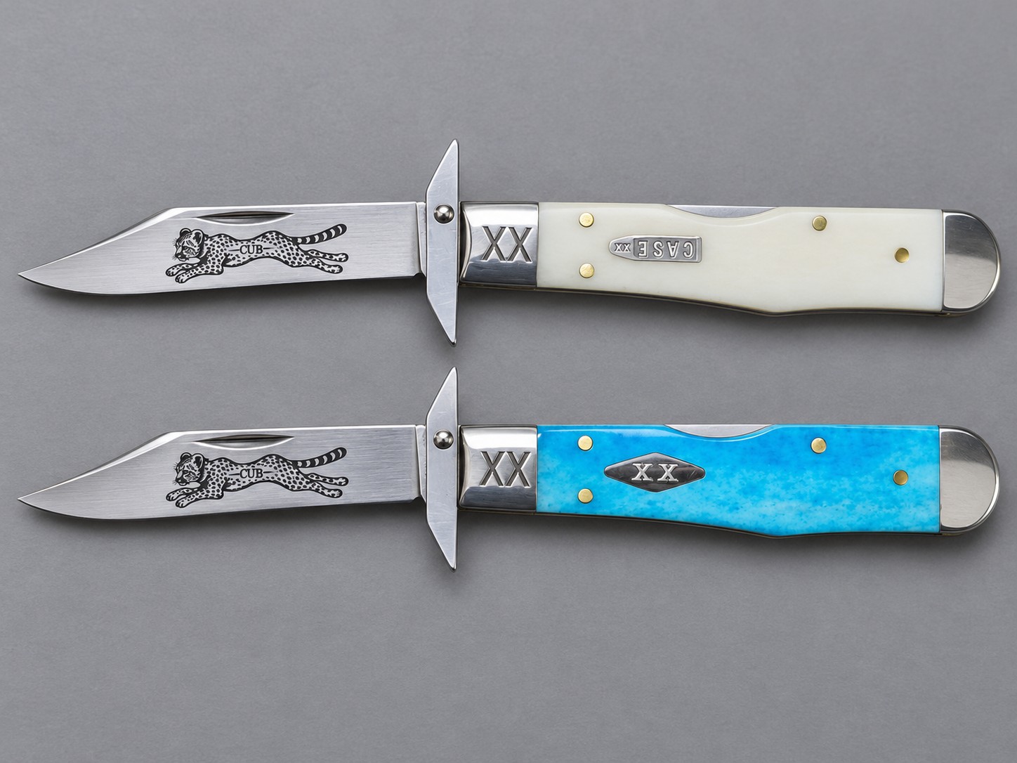 Pair of engraved cheetah knives