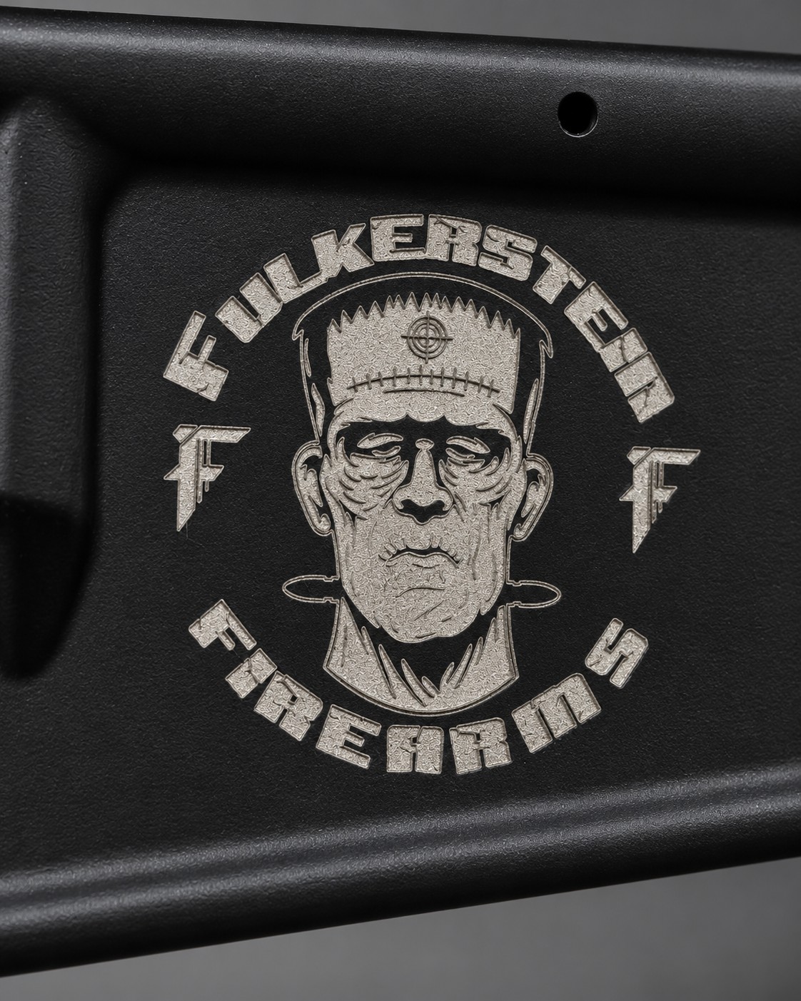 Frankenstein logo engraved on an AR-15 lower receiver