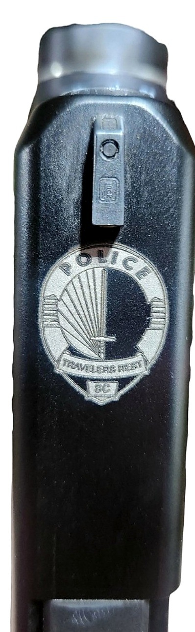 Engraved police insignia gun slide